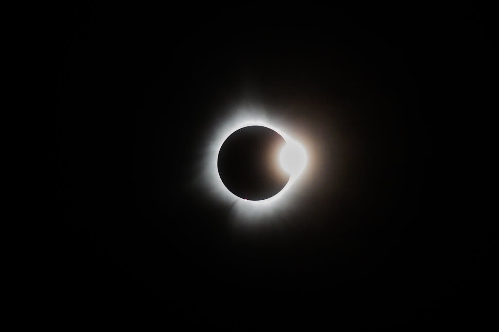 Capture of a breathtaking solar eclipse showcasing the sun's corona and lunar silhouette.