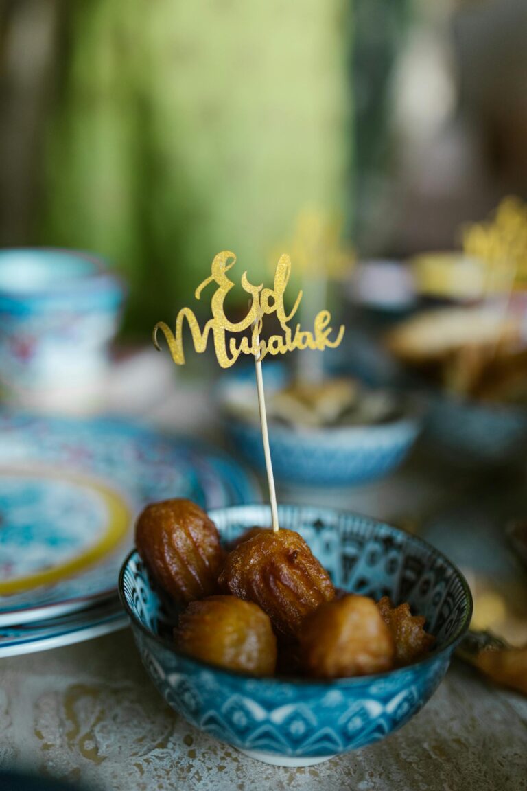 Charming Eid Mubarak scene with traditional sweets in a ceramic bowl, perfect for festive occasions.