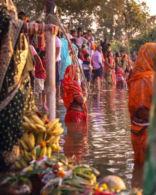"Pitru Paksha ritual: devotee performing tarpan by the river during Pitru Paksha"पितृ पक्ष